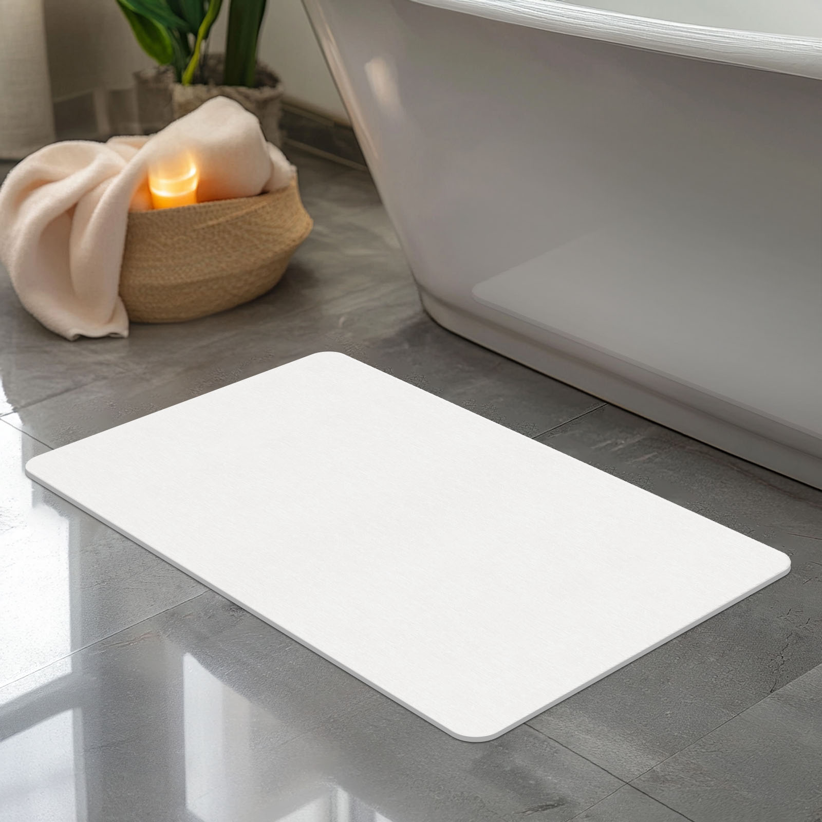 Classic white stone bath mat beside a bathtub
