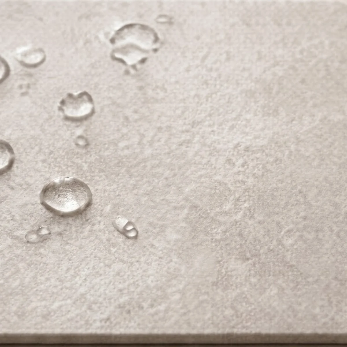 Stone bath mat comparison image showing the stone surface and water droplets.